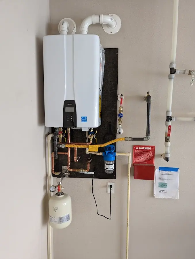 Professional plumber installing copper piping in a Blanchard home